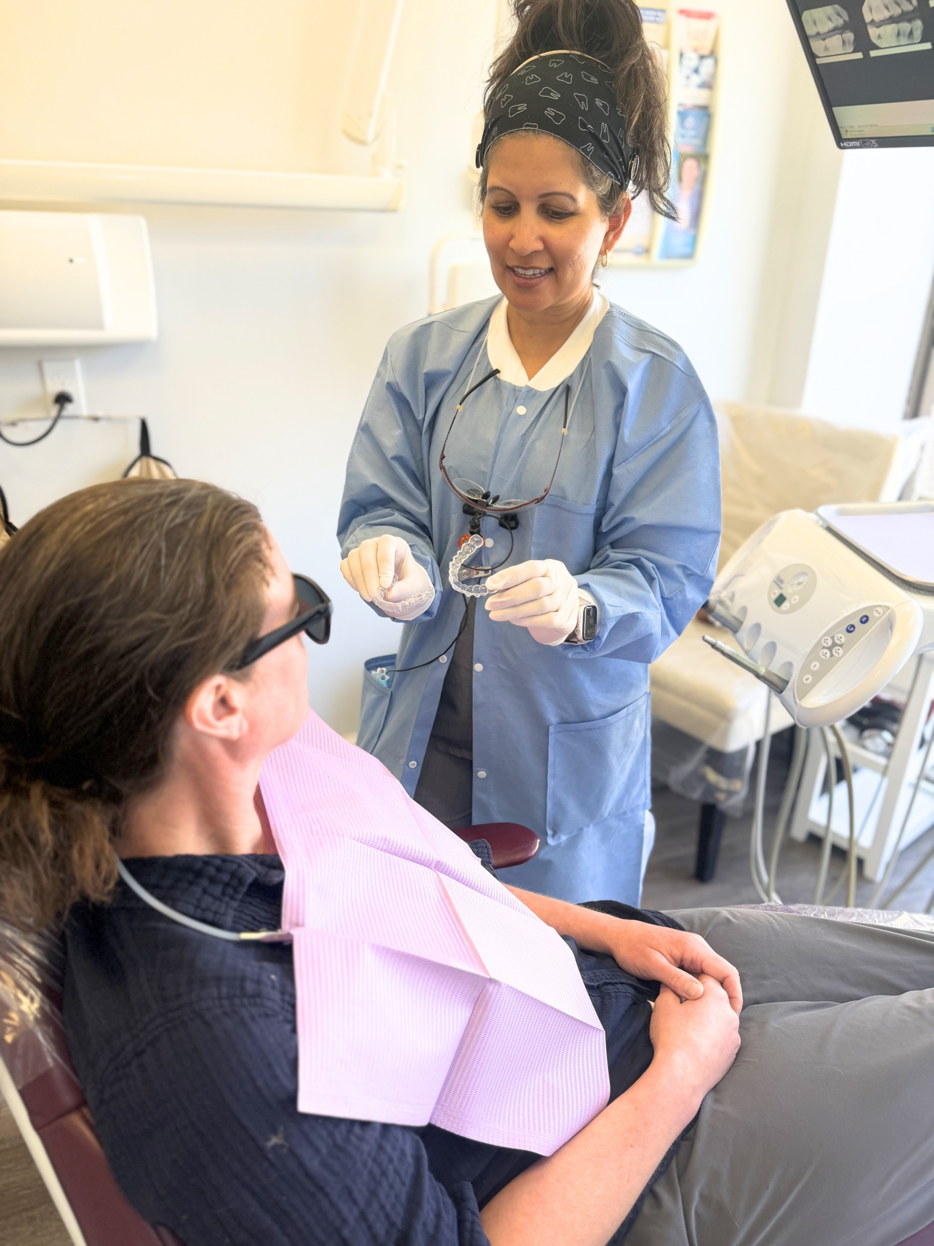 Dr. Patel looking at a patient